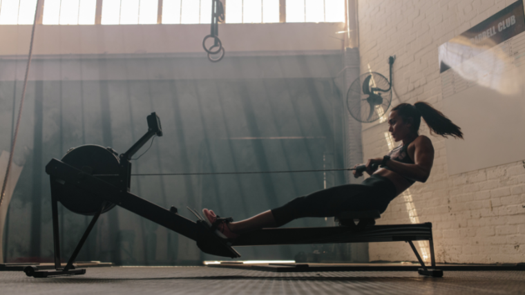 Athlete rowing in the gym.