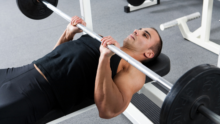 Athlete performing a close grip bench press