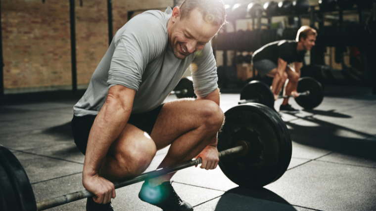 athletes feeling good in the gym lifitng barbells