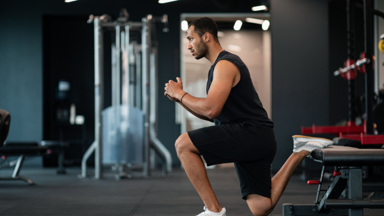 Person squatting deep into the bulgarian split squat exercise