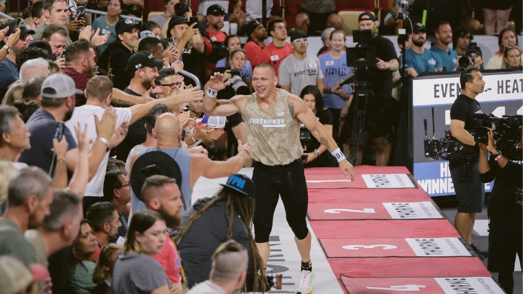 Roman Khrennikov greets a crowd of people at the finish line of the 2022 CrossFit Games.