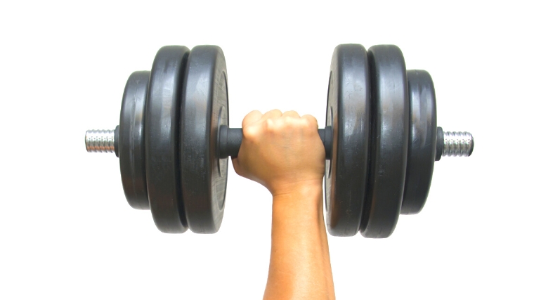 A hand gripping a barbell