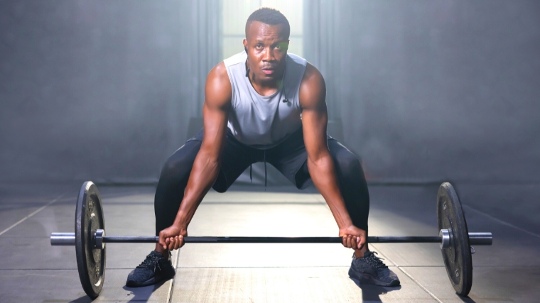 A person holding a barbell.