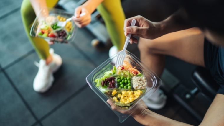 Healthy food of two people at the gym.