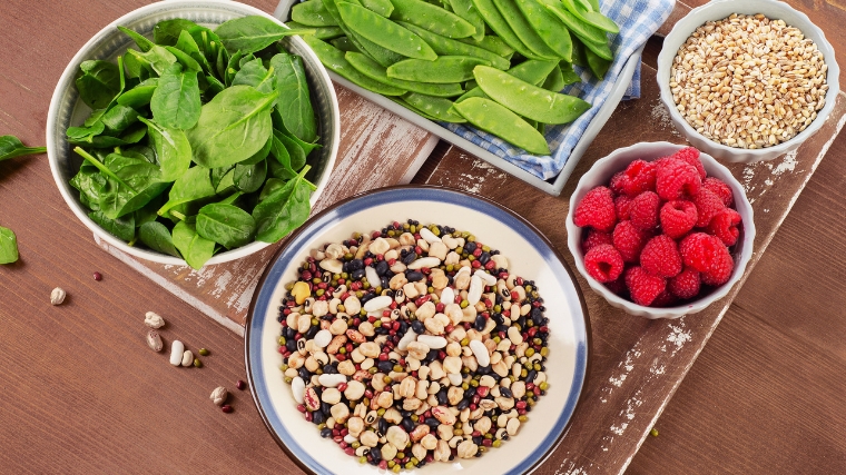 High fiber foods on wooden background.