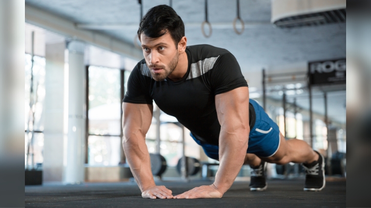 Person doing a push-up in the gym.