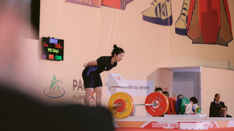 Weightlifter Pei Xinyi bows after snatching a new Youth World Record