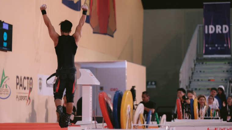 Rahmat Erwin Abdullah celebrates after hitting a new World Record clean & jerk