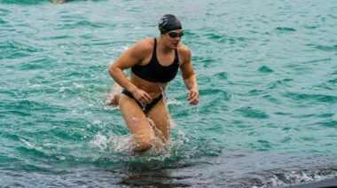 A CrossFit athlete swimming at Wodapalooza.