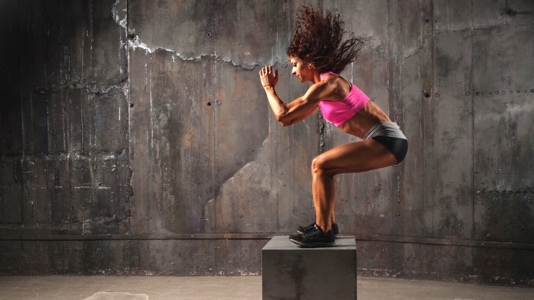 A Crossfitter box jumping.