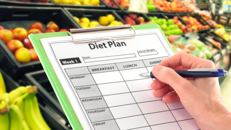 A clipboard with a blank diet plan sheet.