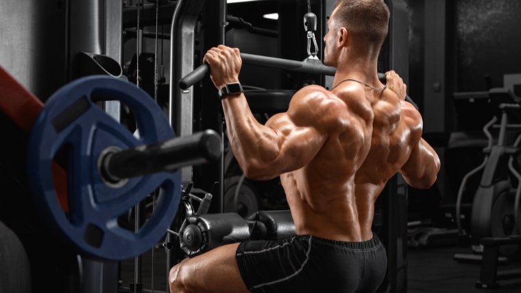 A muscular bodybuilder working on out on the bench.