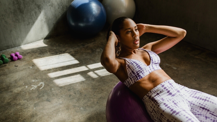 A person exercising with a stability ball.