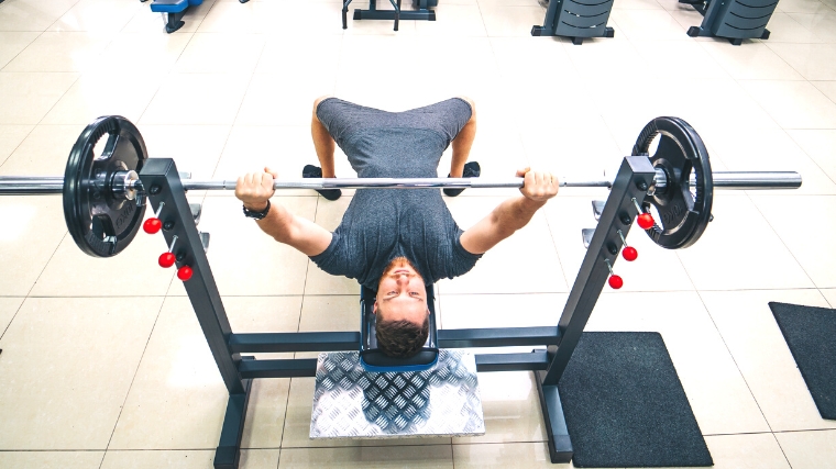A person is doing a bench press.