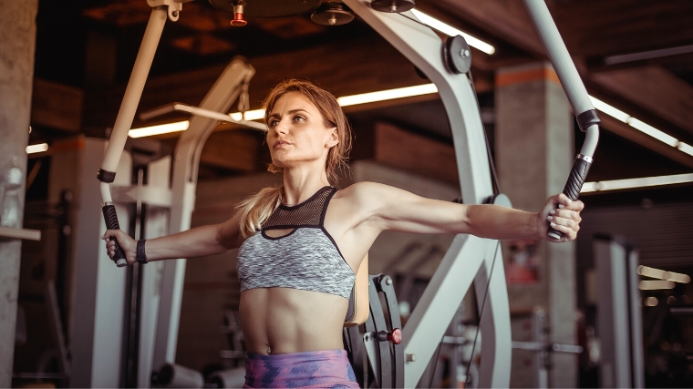 A person woking out in the gym.