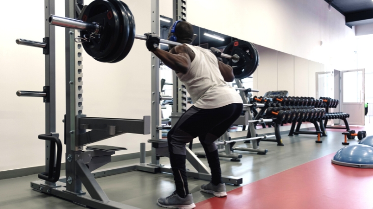 Person lifting a heavy barbell.