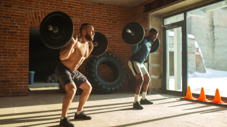 Two people doing the Steinborn Squat.