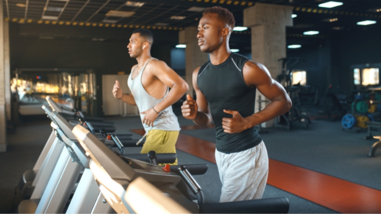 Two people on treadmills.