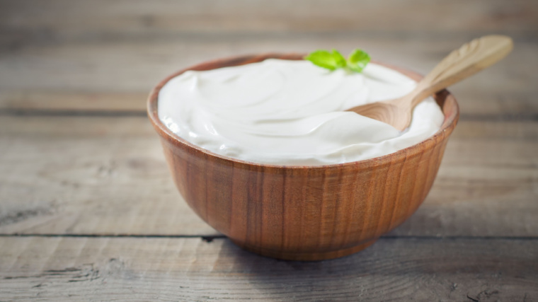 Yogurt in a wooden bowl