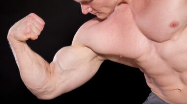A bodybuilder flexing their muscle.