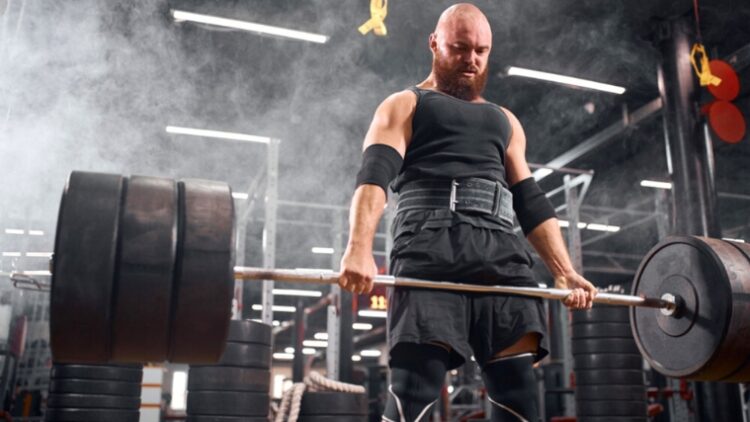 A person performing a deadlift.