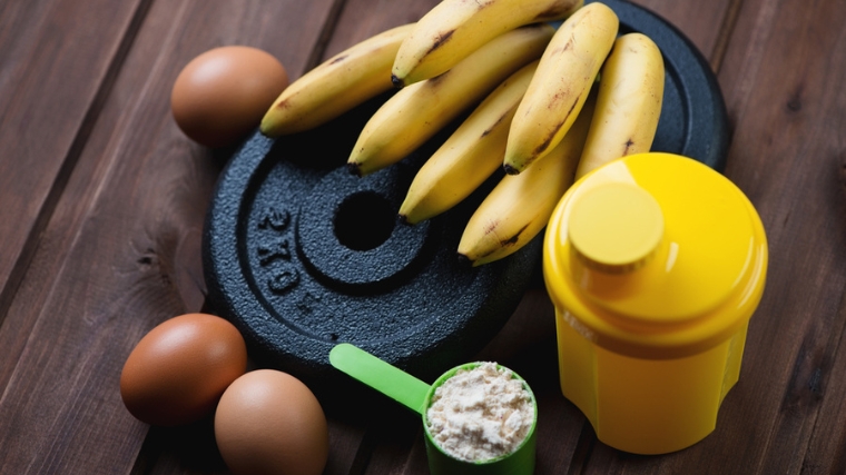 A scoop of supplement powder, a few eggs, bananas and weights.