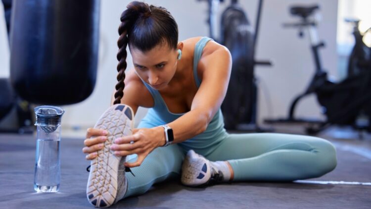 A person stretching their foot.