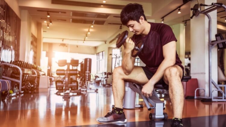 A person working out with one dumbbell