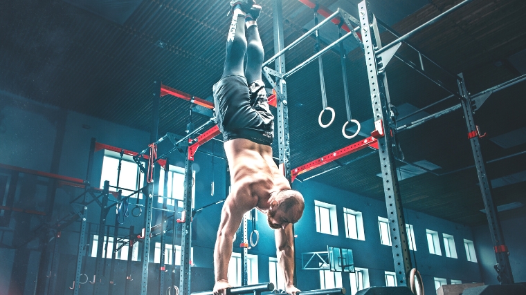 A person doing a handstand.