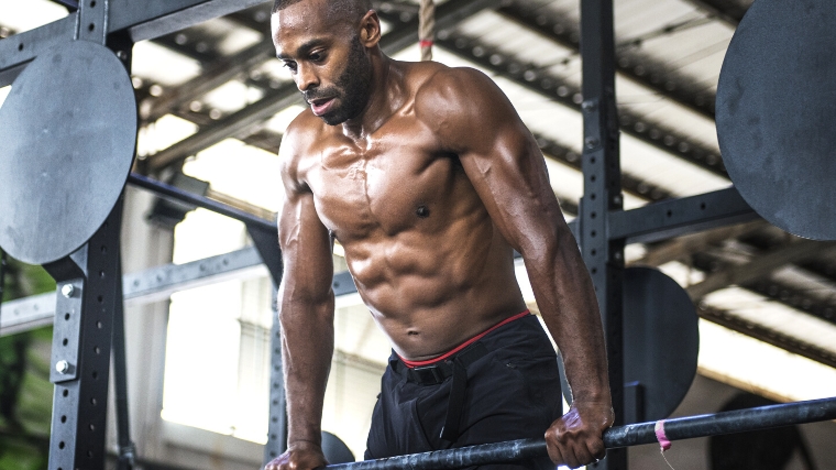 A person doing a muscle up.