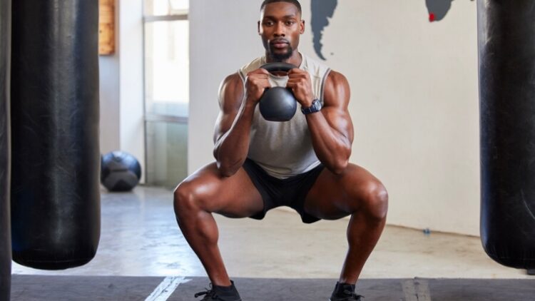 A person doing a sumo goblet squat.