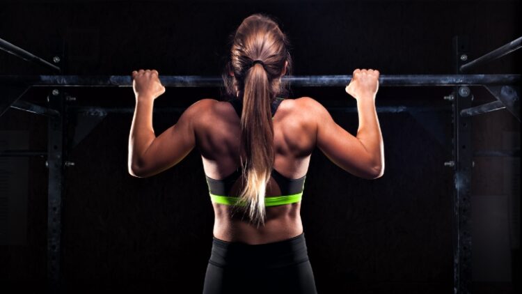 A person doing pull-ups for a Crossfit fran.