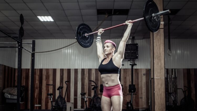 A person doing thrusters for a Crossfit fran