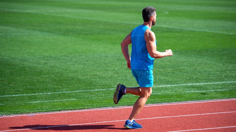 A person jogging in the track.