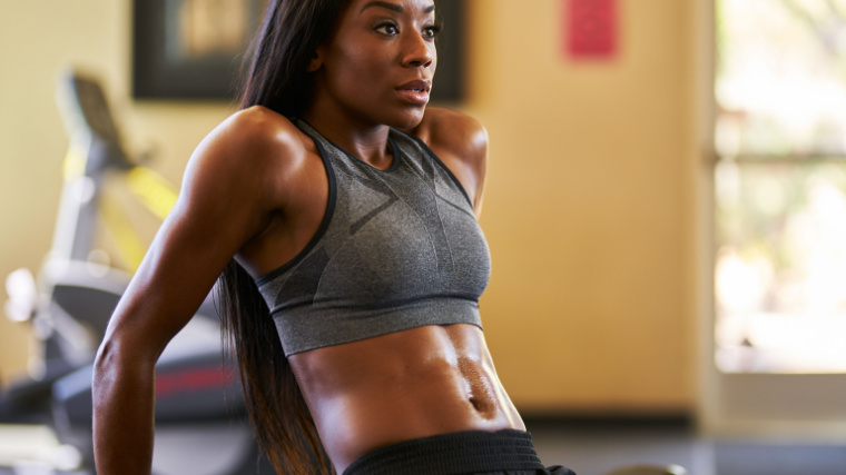 An athlete pauses between reps in the gym.