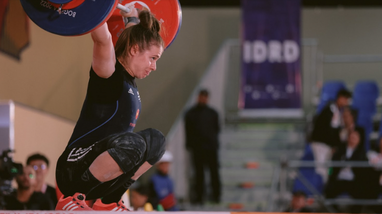 Weightlifter Loredana Toma holds onto snatch in competition