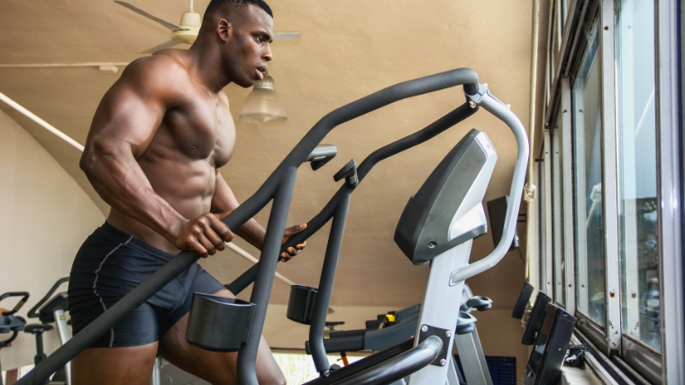 A person warming up on the stair-stepper.