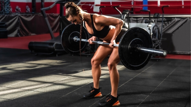 A person workout with a barbell.