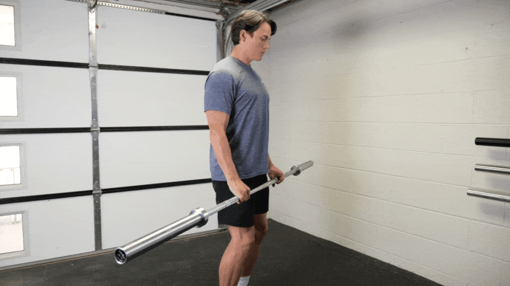 A person doing the reverse barbell curl.