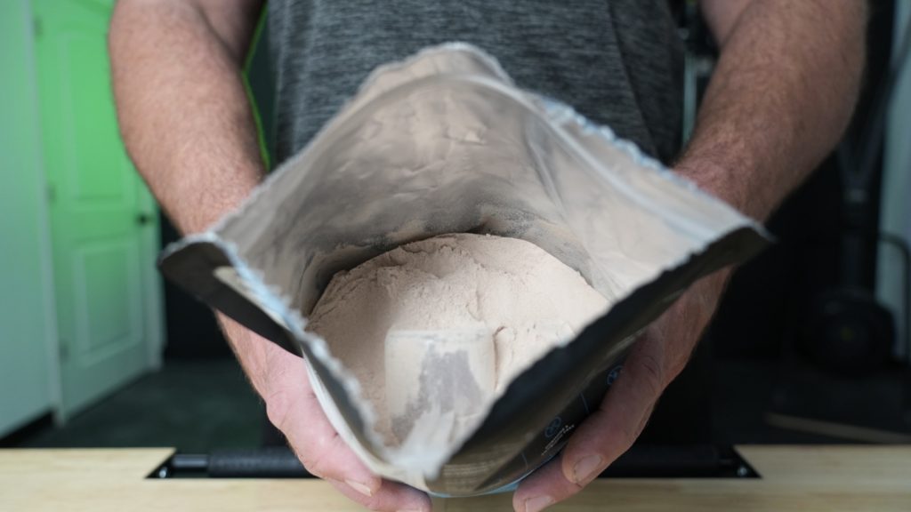 Looking into an opened bag of Legion Whey+ whey protein powder