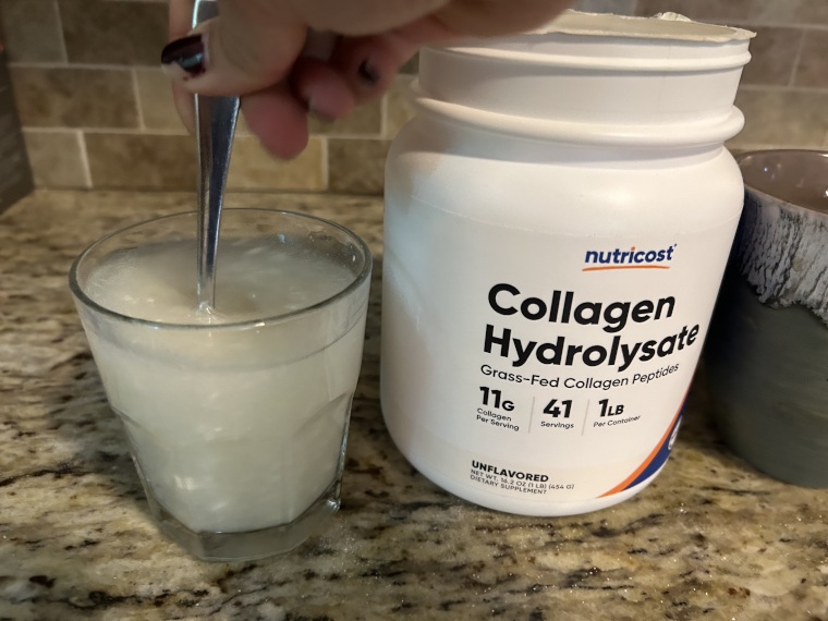 Our tester stirring a serving of Nutricost Collagen into a glass