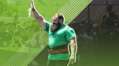 Bobby Thompson raises his arm in the air, wearing a green t-shirt, at the 2023 WSM contest.