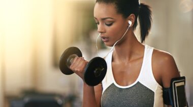 A person holding a dumbbell.