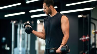 A person training with dumbbells.