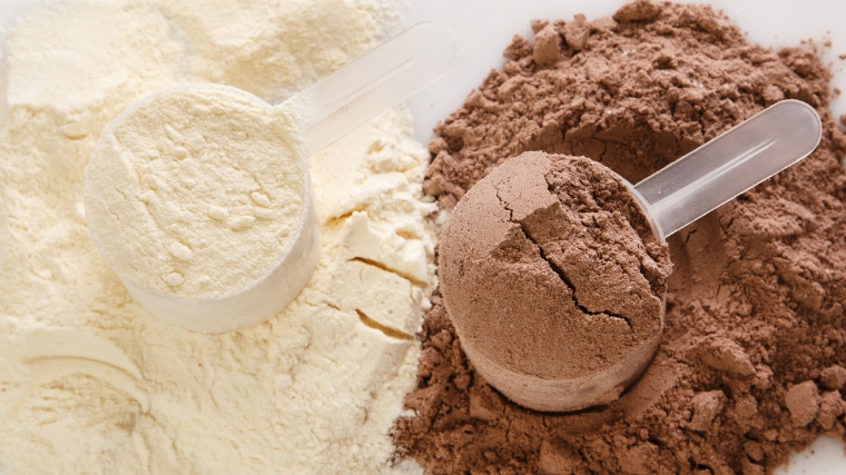 Protein powder in scoops.