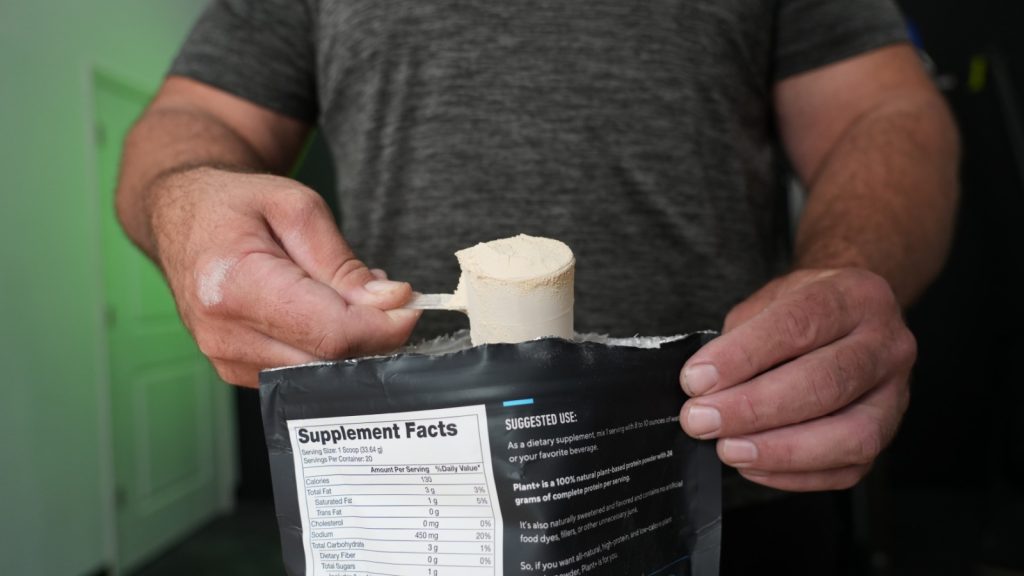 BarBend tester showing a scoop of Legion Plant+ protein powder