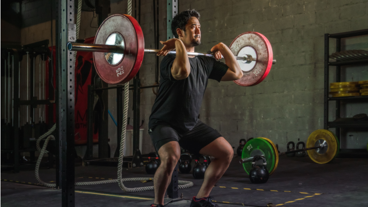 Man stands up out of clean exercise using quads