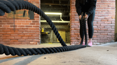 An athlete using the Titan Fitness Battle Rope.