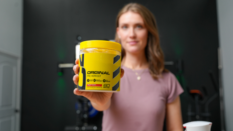 Our tester holds up a container of Cellucor C4 Original Pre-Workout.