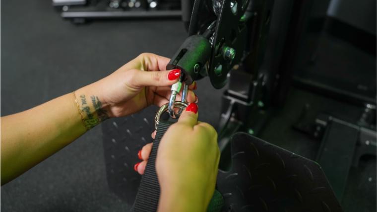 Our tester changing the handle on the Gronk Fitness Functional Trainer.